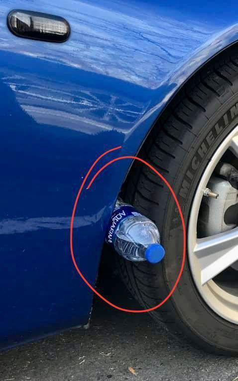 The Curious “Bottle on Tire” Trick: What It Means and How to React Safely